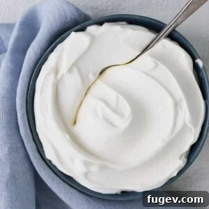 Fluffy Homemade Delight 3 Close-up of fluffy homemade whipped cream swirl detail in a bowl