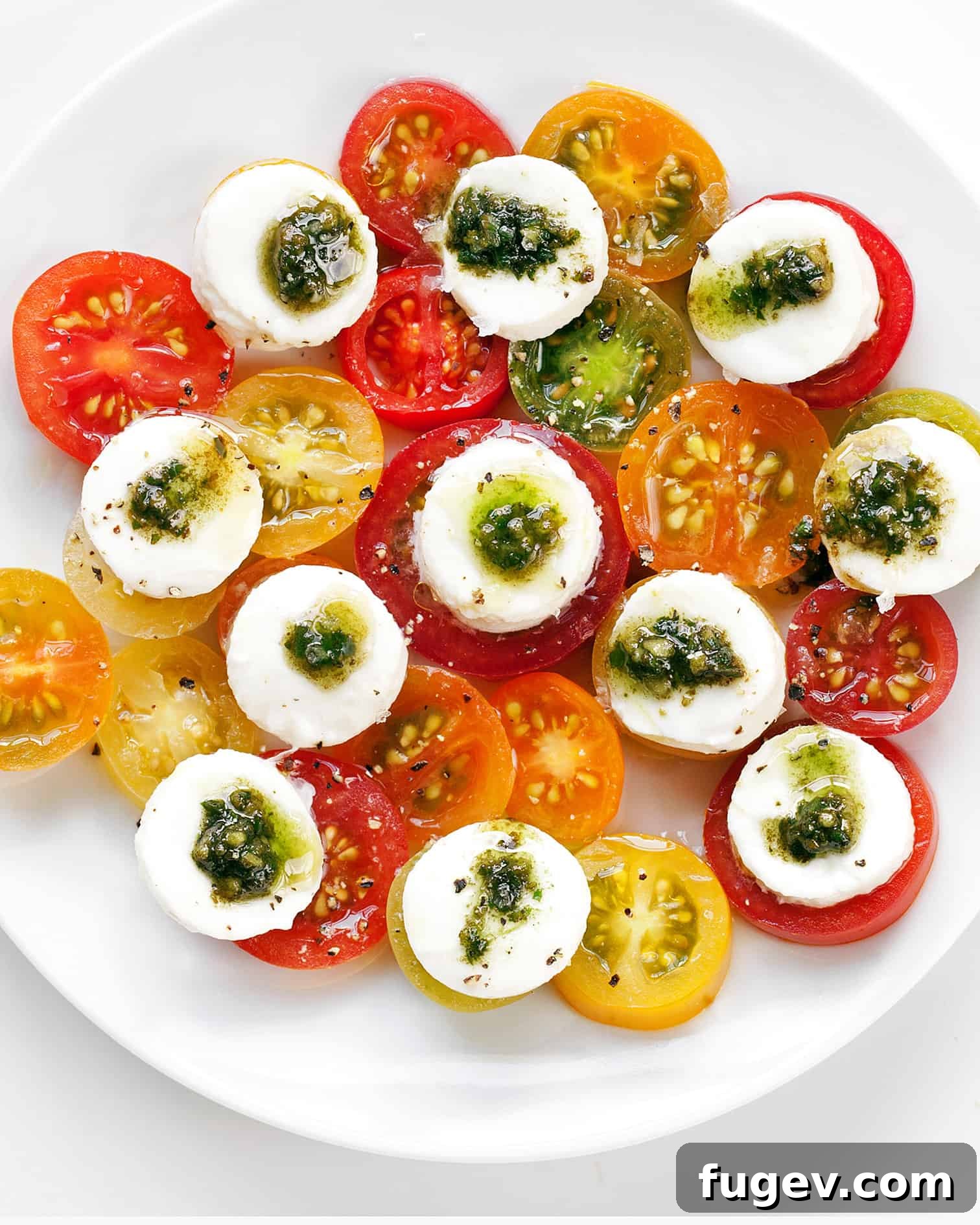 Fresh Italian Trio 3 Caprese Salad with an additional drizzle of balsamic glaze and fresh basil, showcasing rich colors and inviting textures.