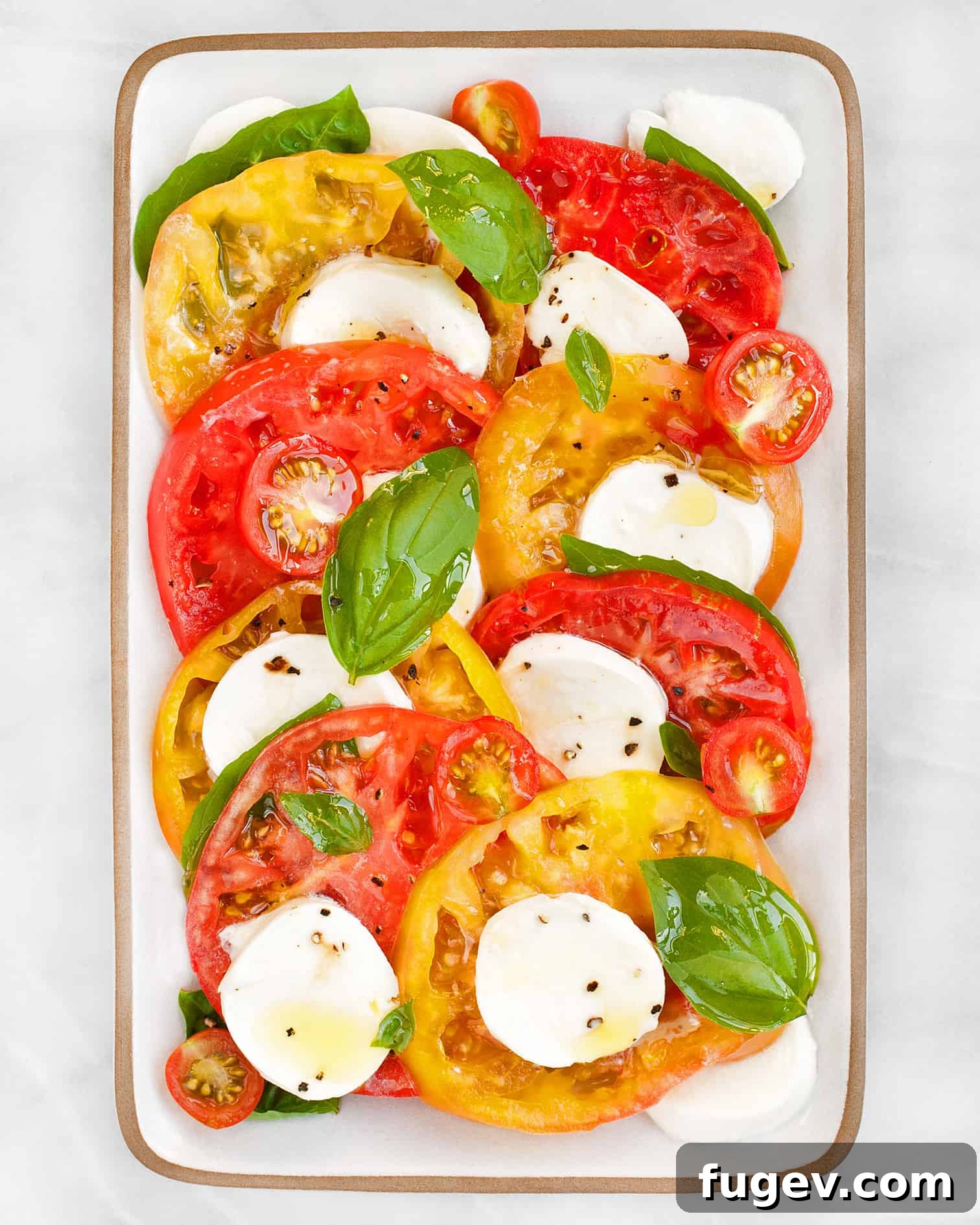 Fresh Italian Trio 4 An overhead view of a colorful Caprese salad, showcasing the fresh, vibrant ingredients and inviting presentation.