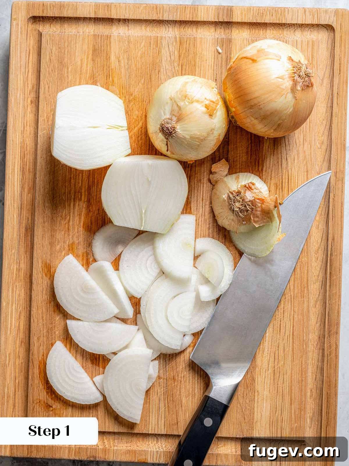Juicy Homemade Turkey Burgers 5 Freshly sliced yellow onions, ready for caramelizing, arranged on a cutting board.