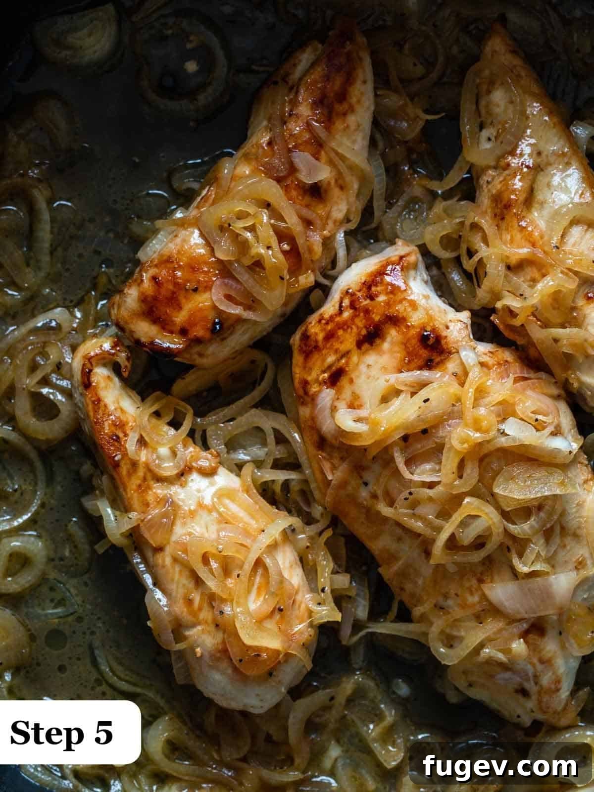 Golden Shallot Chicken 6 Step 5 of the process, showing browned chicken breasts being added back into the pan with the shallot and wine sauce.