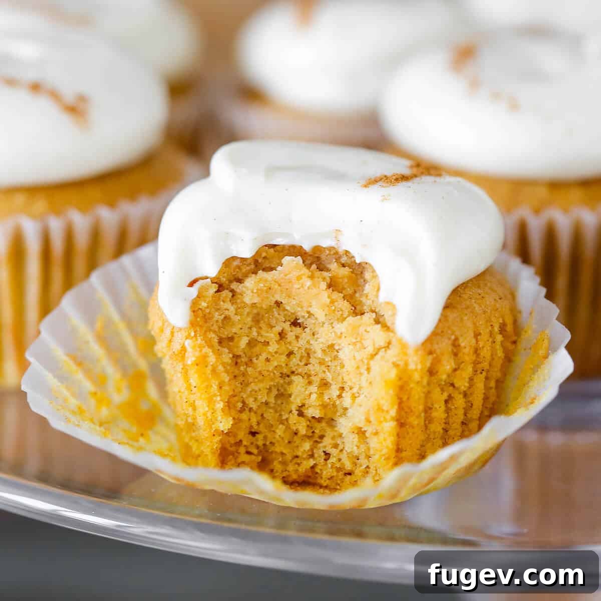 25 Irresistible Pumpkin Recipes for Fall 19 Pumpkin Spice Cupcakes with Cream Cheese Buttercream, showing interior texture