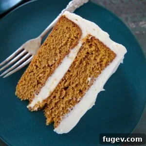 Pumpkin Spice Layer Cake slice on a plate, ready to be enjoyed