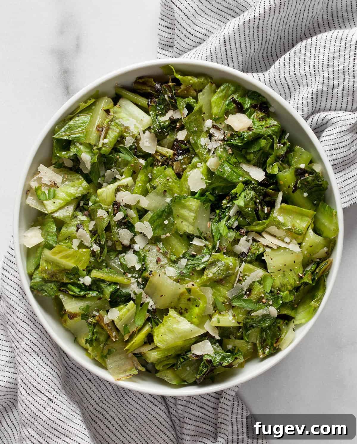 Fire Kissed Romaine 4 Chopped grilled romaine salad in a bowl, ready to be served.