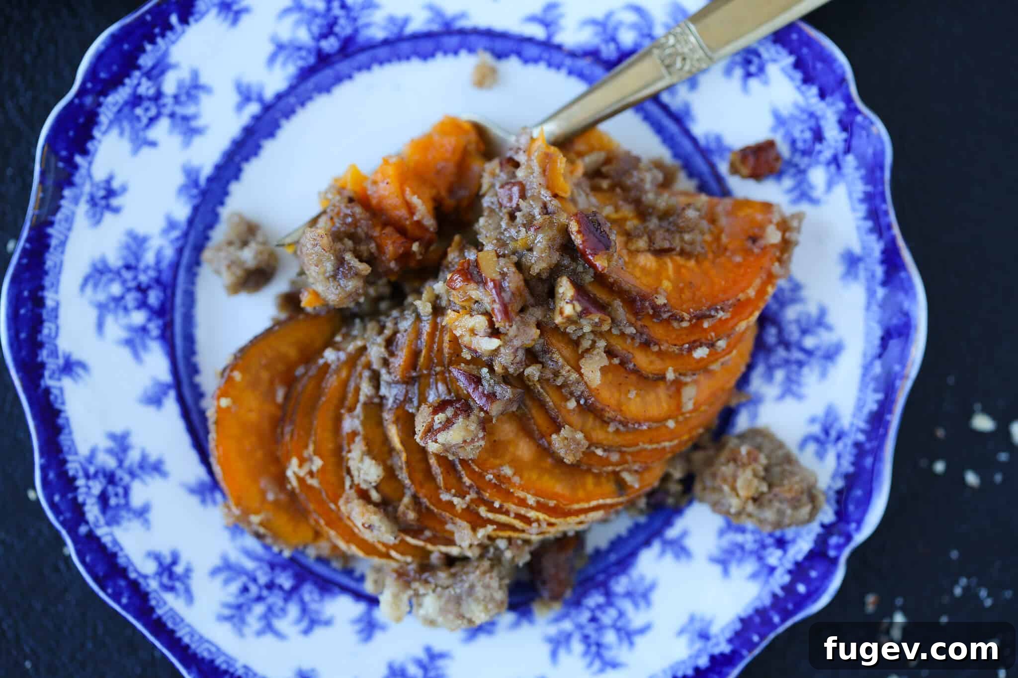 Golden Accordion Sweet Potato Bake 6 Hasselback Sweet Potatoes on Blue and White Plate