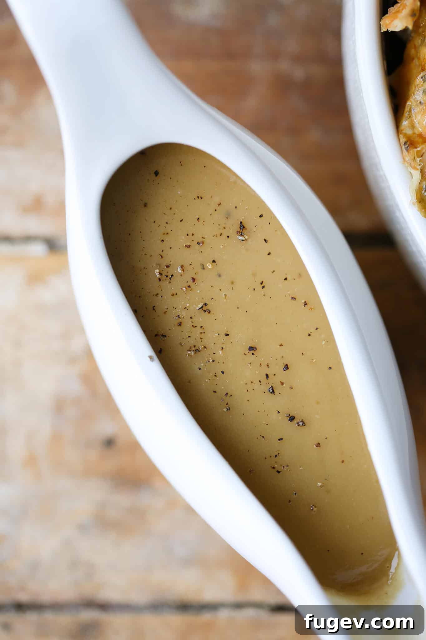 Perfect Gravy from Pan Drippings 3 Gravy From Scratch Wood Slate Backdrop, showing a rustic setting for homemade gravy.
