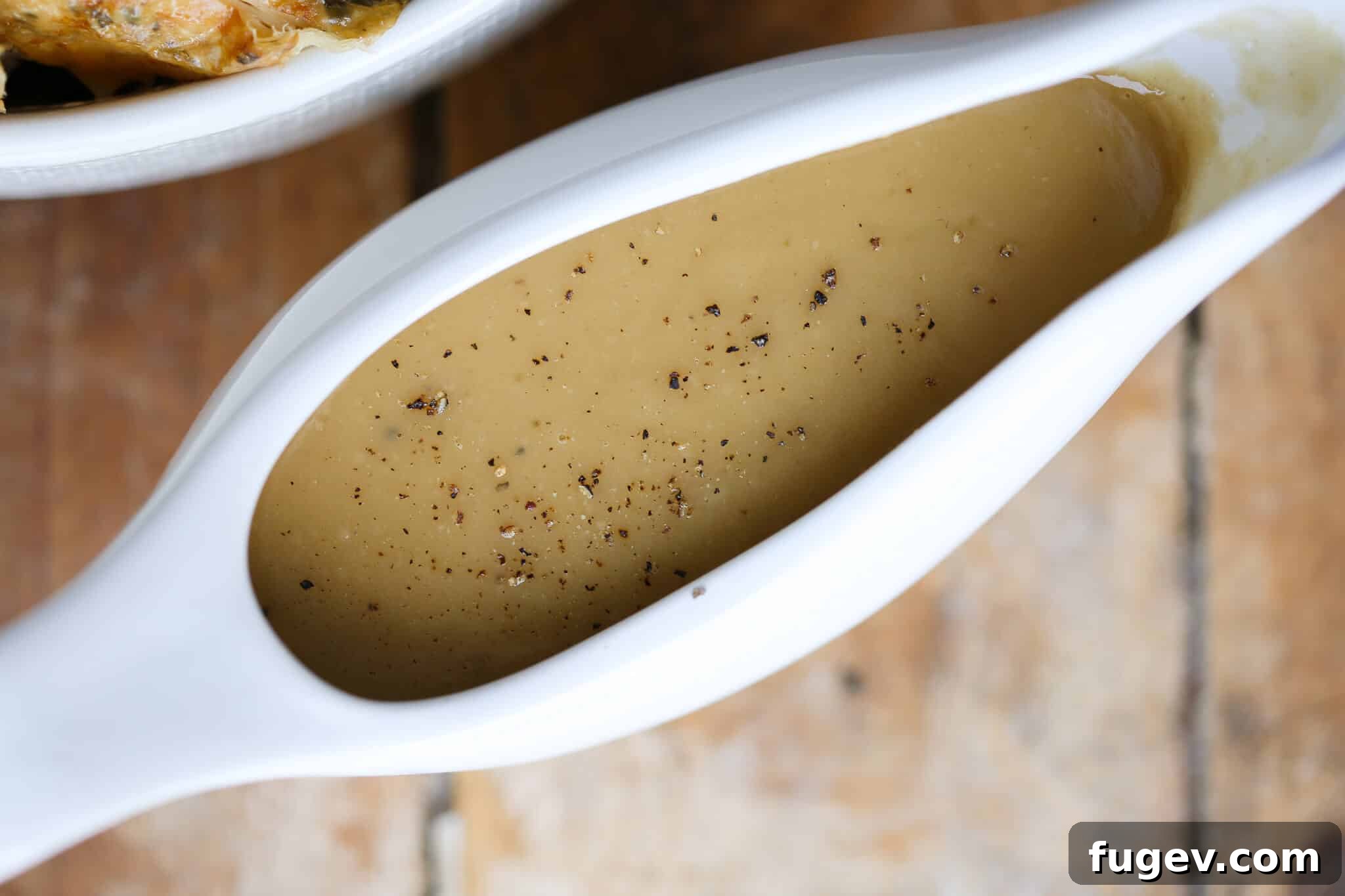Perfect Gravy from Pan Drippings 4 Sauce From Scratch Ready to Serve, showcasing a rich, dark gravy in a boat.