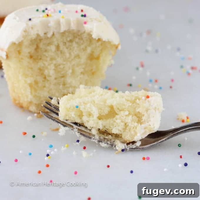 Sprinkles-Inspired Vanilla Cupcakes 5 Sprinkles Copycat Vanilla Cupcakes Closeup with fork