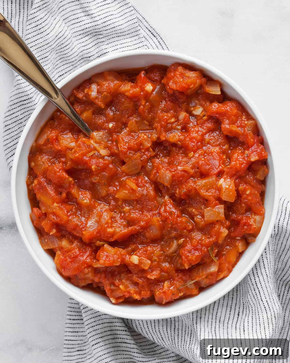 Garden-Fresh Roma Tomato Sauce 8 Roma tomato sauce in a serving bowl, ready to be enjoyed.
