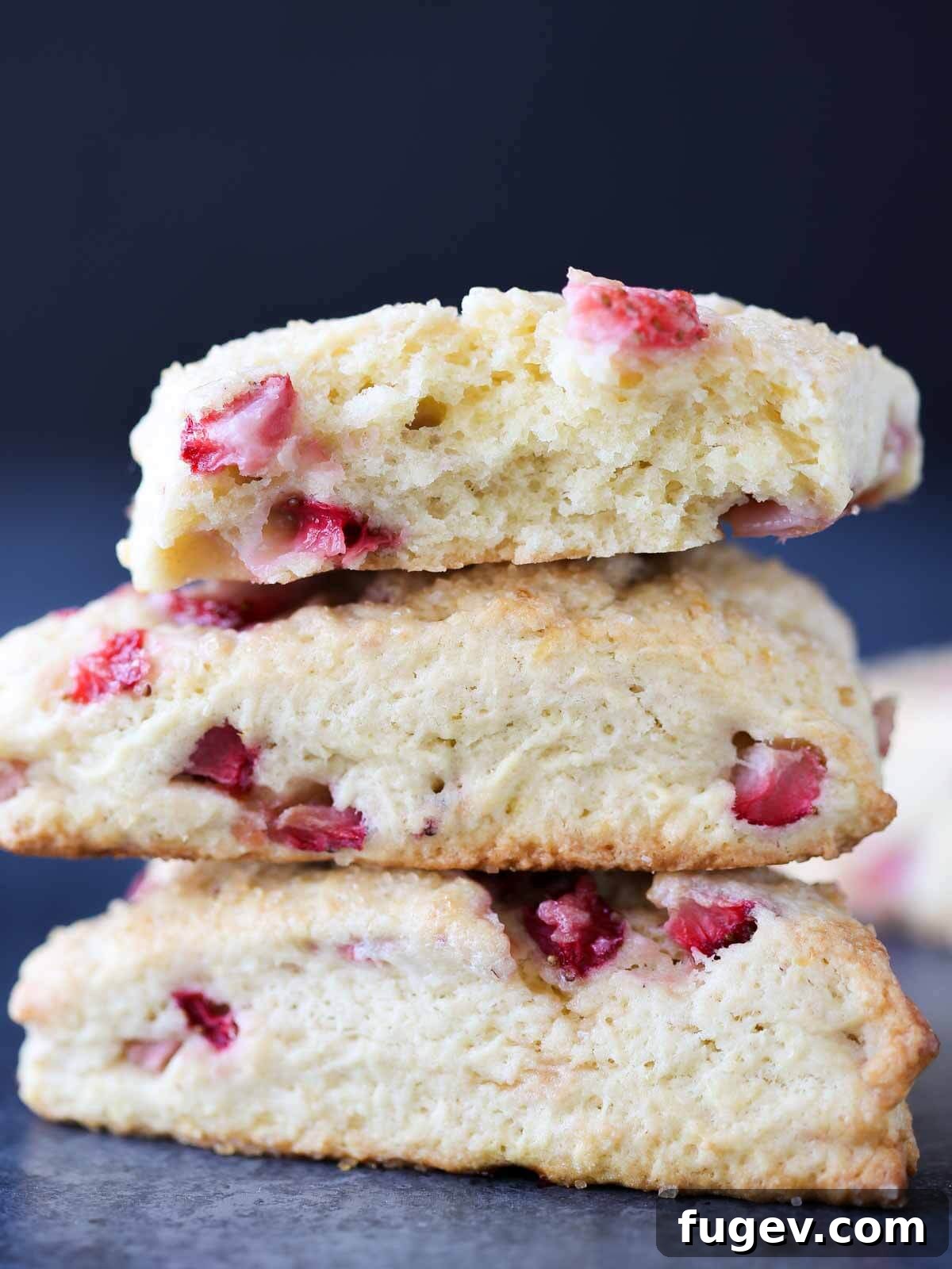 Sweet Summer Strawberry Scones 2 Freshly baked Strawberry Scones on a cooling rack, ready to be enjoyed.