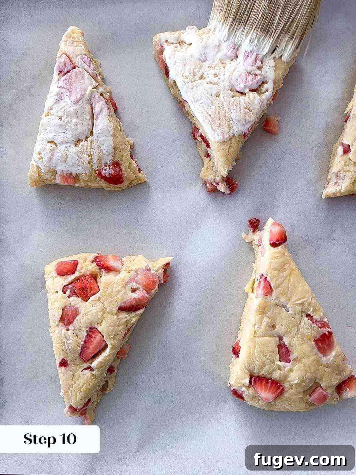 Sweet Summer Strawberry Scones 11 Freshly baked strawberry scones cooling on a rack.
