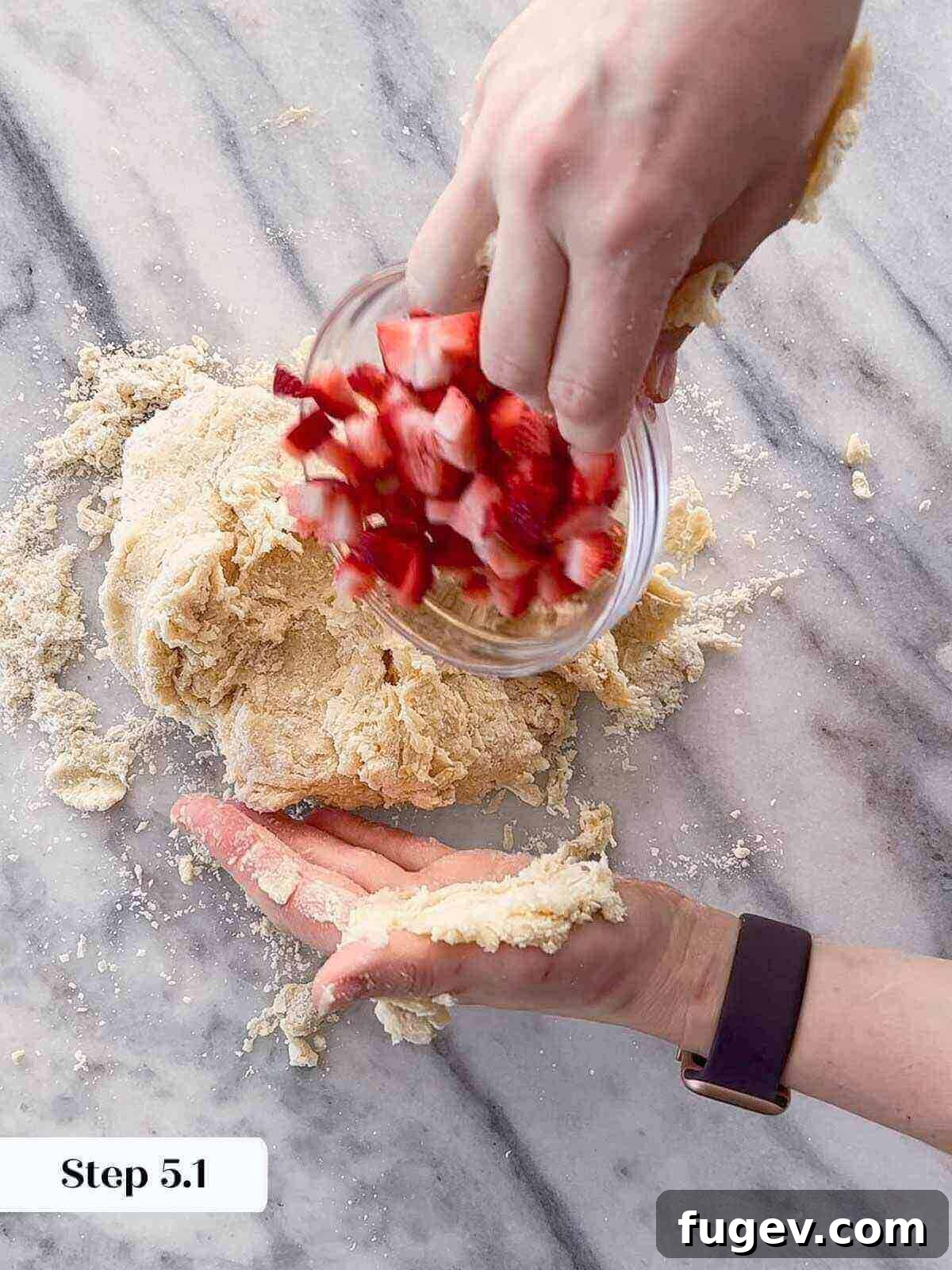 Sweet Summer Strawberry Scones 7 Scone dough being gently kneaded on a floured surface.