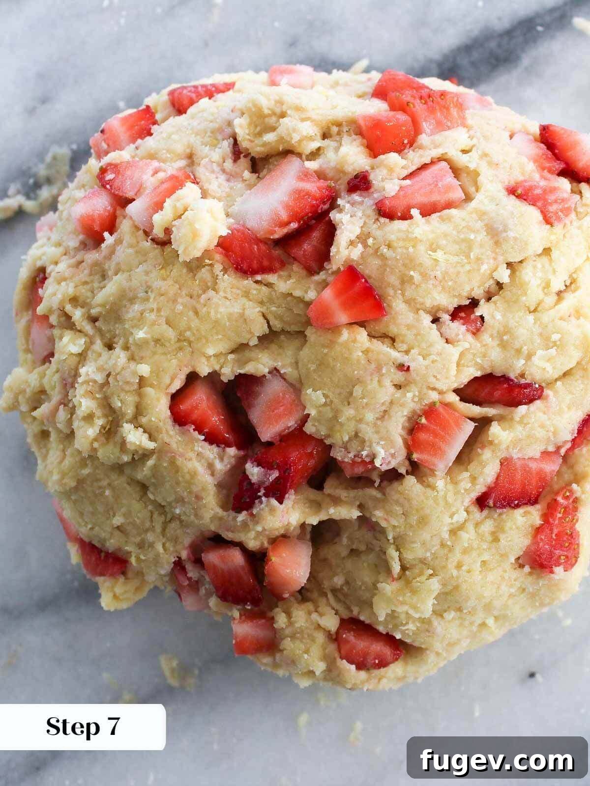 Sweet Summer Strawberry Scones 9 Scone dough being cut into wedges with a bench scraper.
