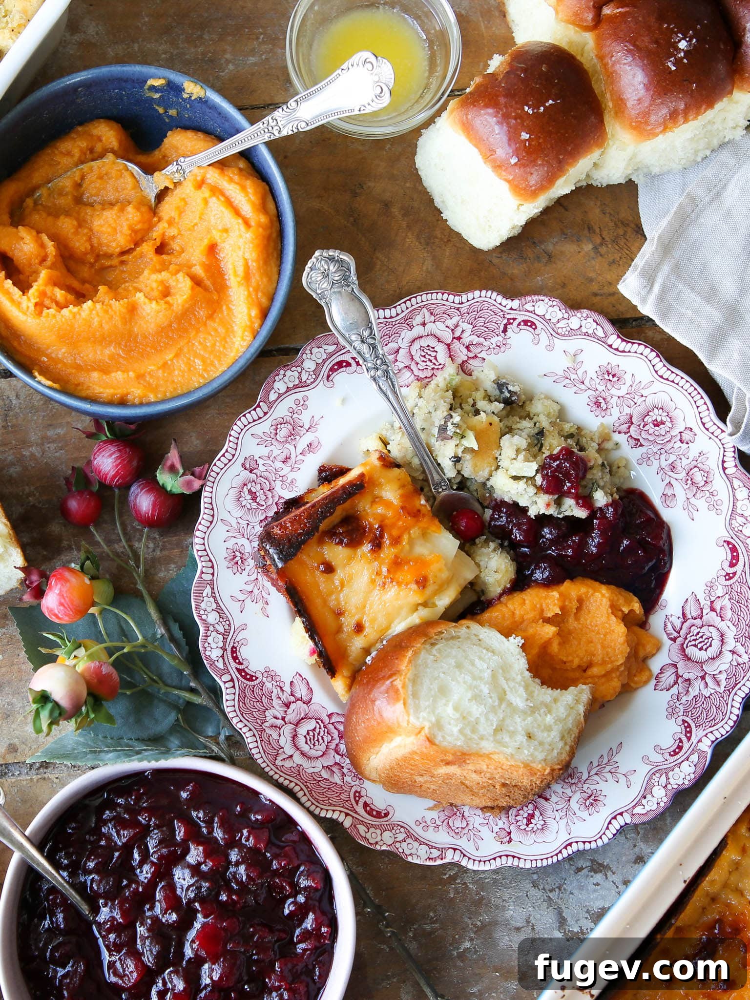 35 Essential Thanksgiving Sides 2 Thanksgiving side dishes beautifully plated on elegant pink plates, ready for a festive holiday meal.