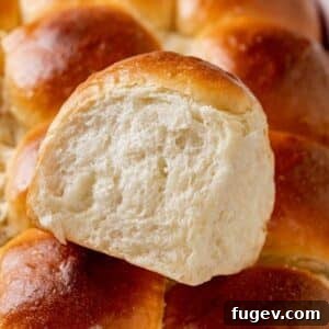 35 Essential Thanksgiving Sides 11 A single, perfectly baked Hawaiian roll with a golden-brown crust.