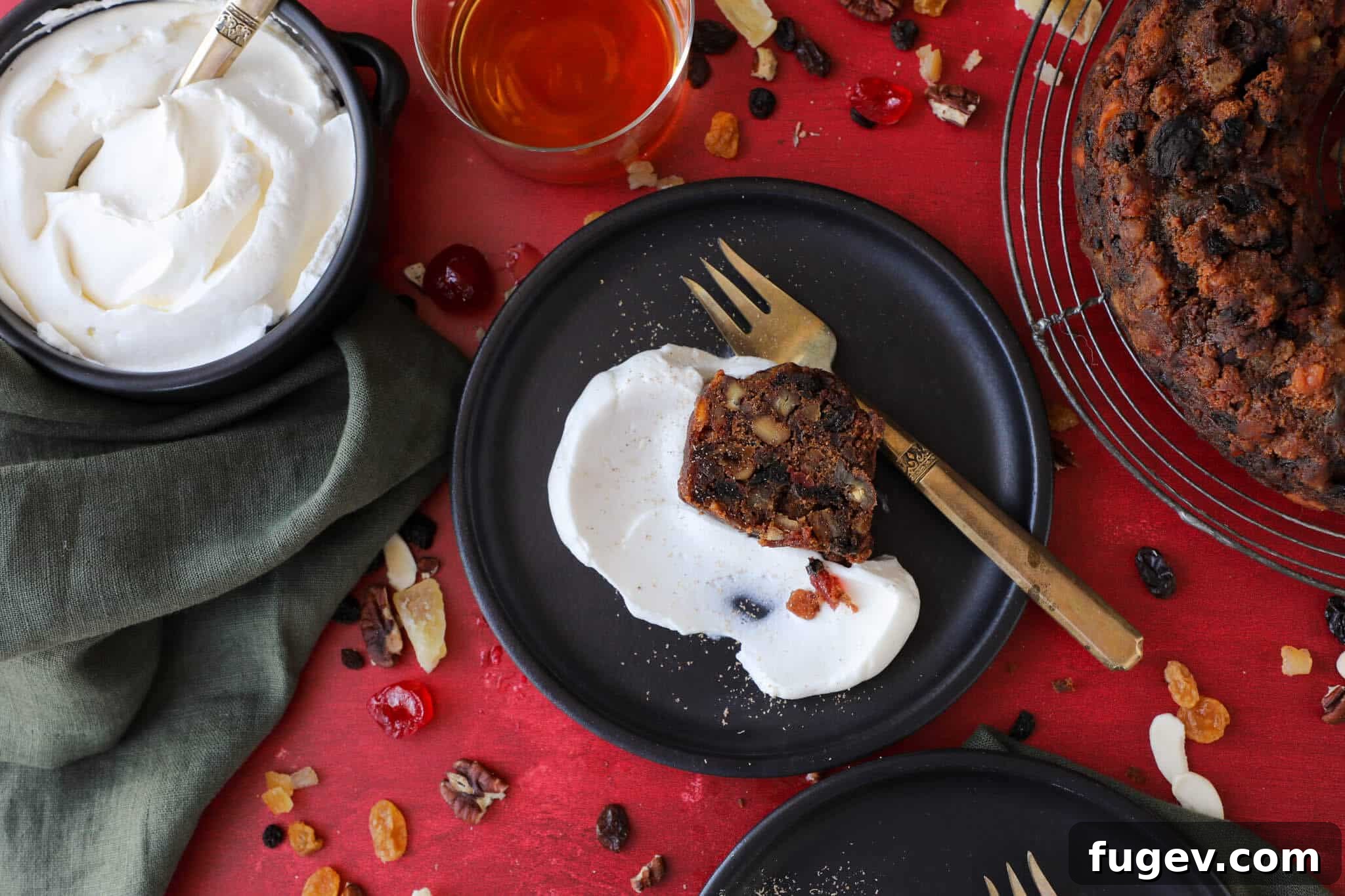 Heritage Fruitcake 4 A slice of Old Fashioned Fruit Cake on a black plate, emphasizing its rich texture and dense filling