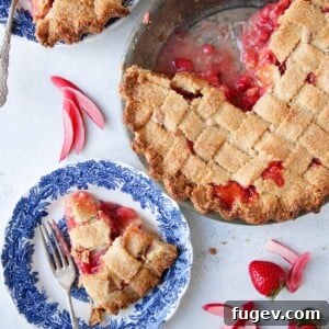 A featured Strawberry Rhubarb Pie baked in an almond lattice crust, showcasing its beautiful presentation.