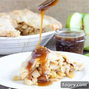 This Apple Butterscotch Pie is absolute heaven! Lightly spiced apples baked inside a flakey all-butter crust with brown sugar butterscotch sauce!