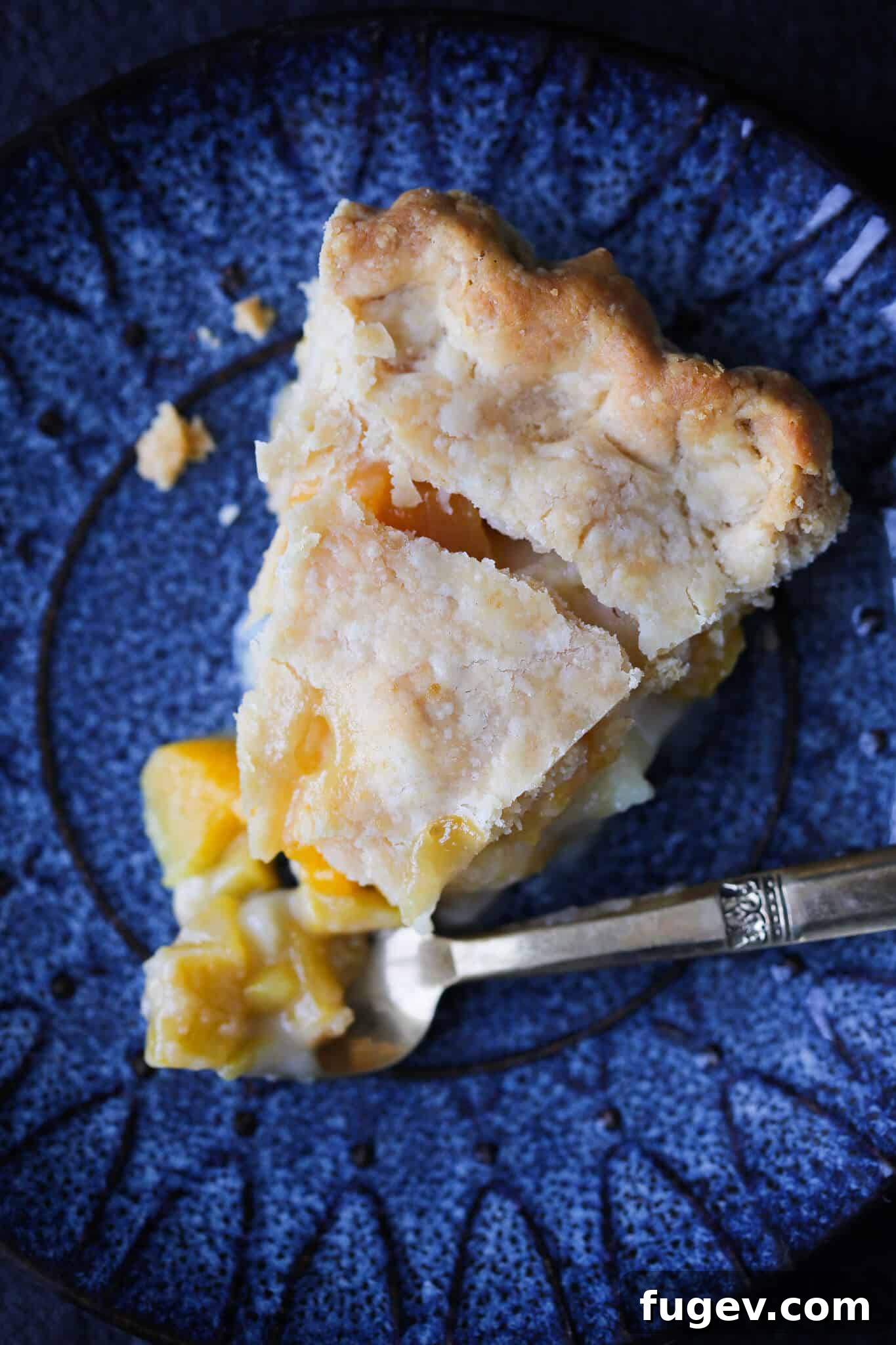 Irresistible Thanksgiving Pie Delights 7 A perfect slice of Old Fashioned Peach Pie, showcasing its vibrant filling and crumbly crust, among the 20 best Thanksgiving pie recipes.