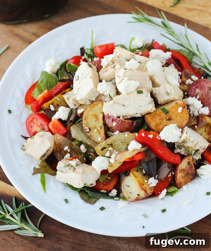 Lemon-Kissed Rosemary Roasted Vegetable Medley 4 A large bowl of warm lemon rosemary roasted vegetable salad with feta cheese and pecans