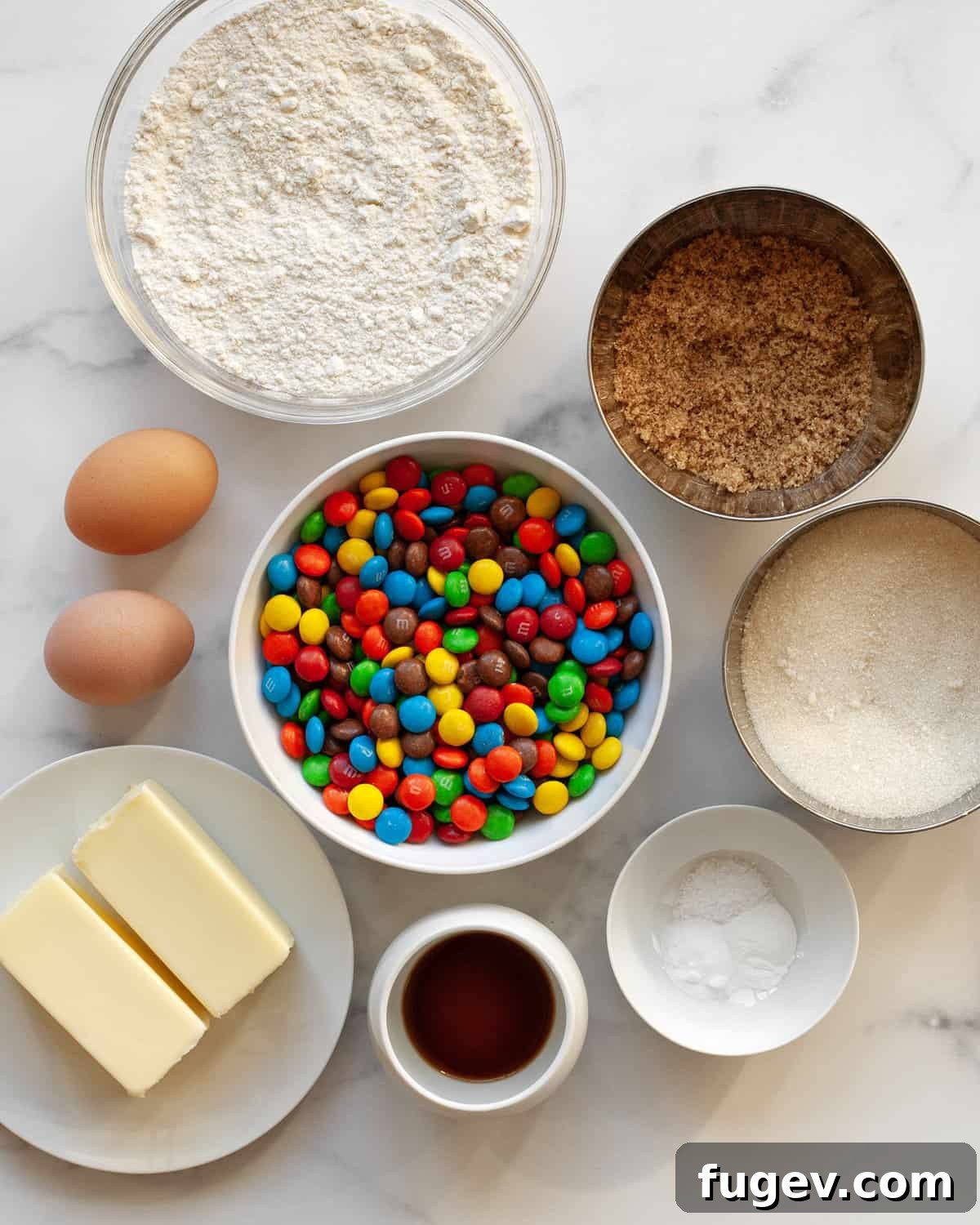 Crispy Colorful Candy Cookies 3 Ingredients for crispy M&M cookies, including flour, sugar, butter, vanilla, eggs, baking powder, baking soda, salt, and M&Ms