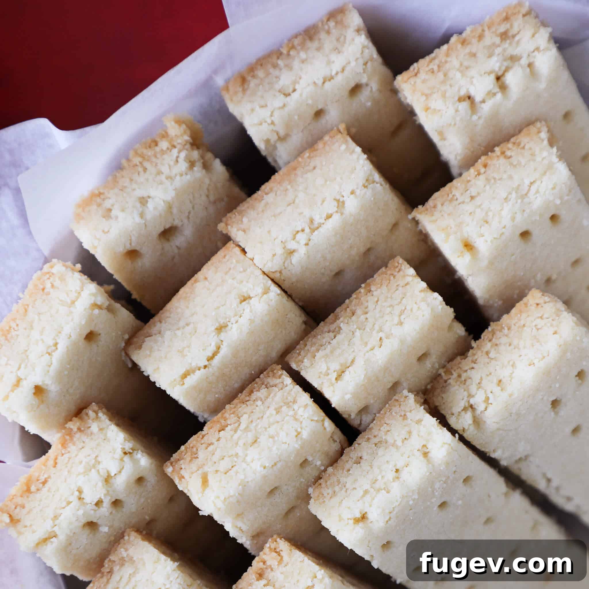 Buttery Scottish Shortbread 3 A charming group of freshly baked Scottish shortbread fingers, perfectly golden and arranged in a rustic basket, ready for serving.