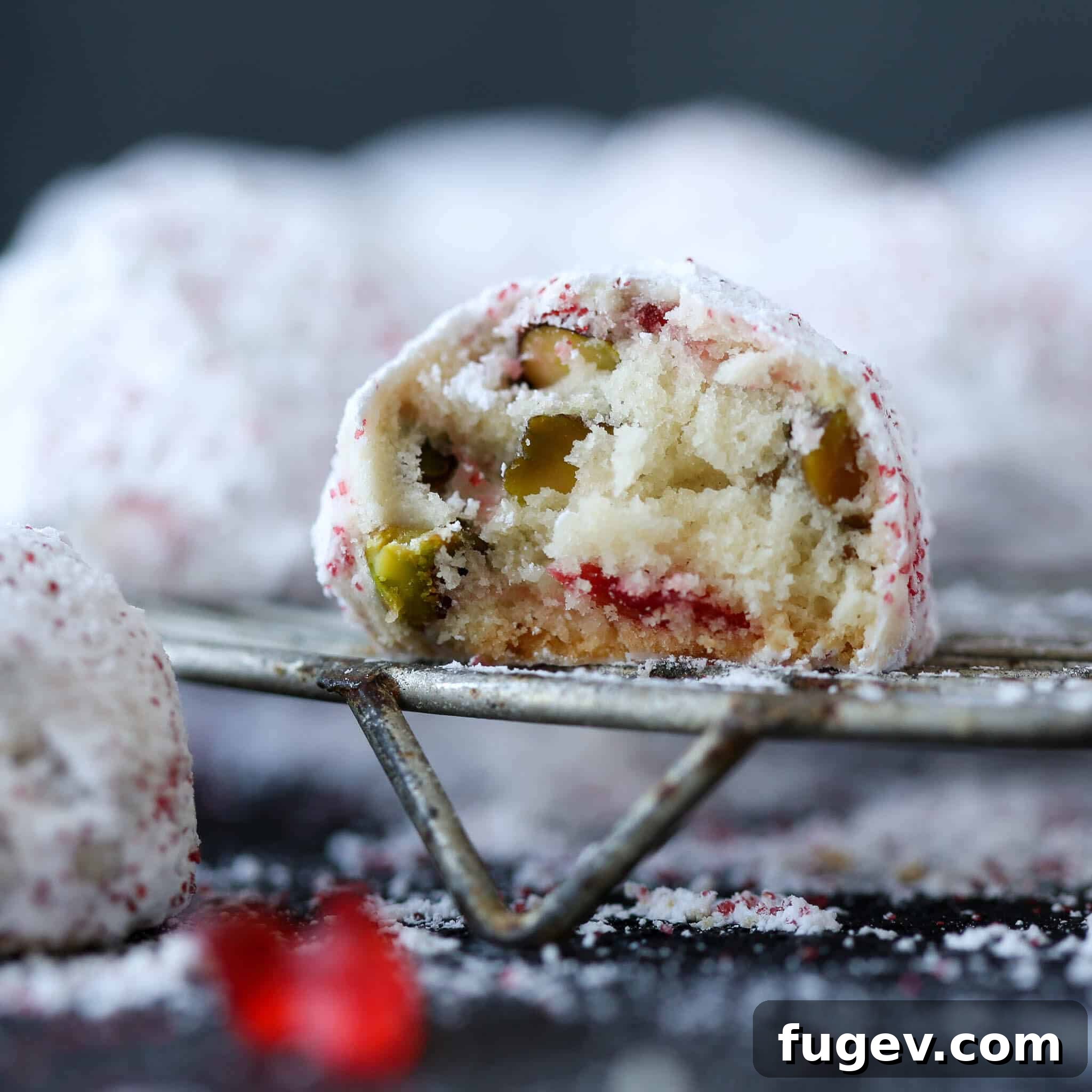Ruby Red Pistachio Snow Kisses 4 Inside a Cherry Pistachio Snowball Cookie, showing the pieces of cherry and pistachio