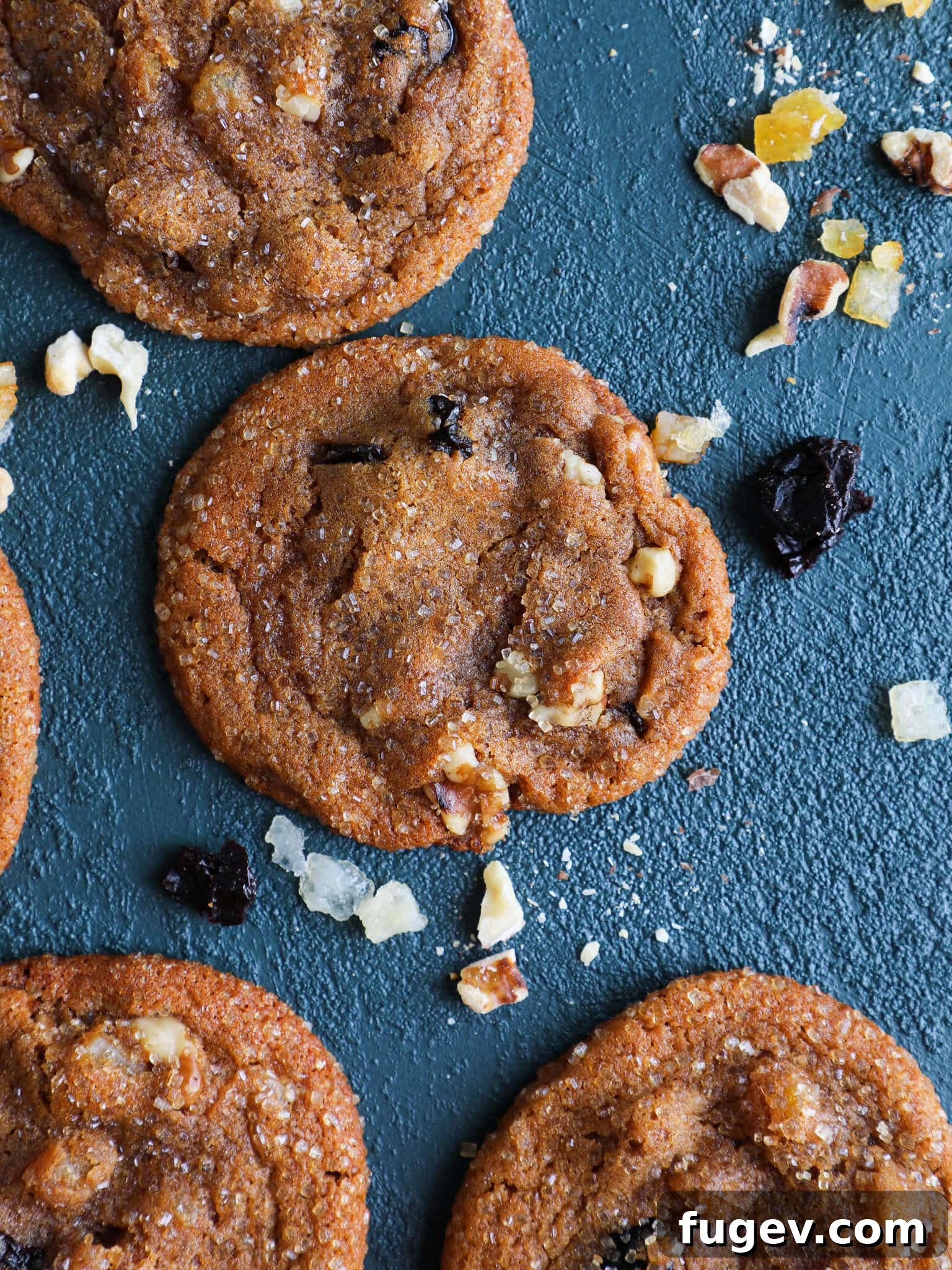 Sun-Kissed Cherry Molasses Chews 3 Cherry Orange Molasses Cookies arranged on a blue background
