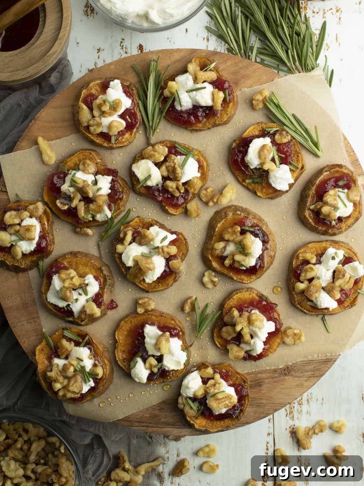 Stress-Free Thanksgiving Recipes 11 Delicate sweet potato bites arranged artfully on a rustic wooden board, perfect for an appetizer.