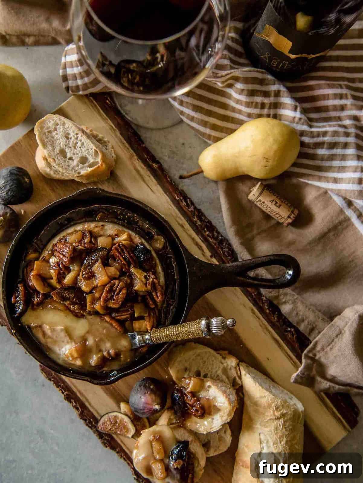Stress-Free Thanksgiving Recipes 13 A delectable fig brie, baked to perfection in a small cast iron skillet, ready to be served.