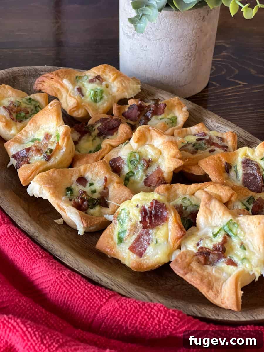 Stress-Free Thanksgiving Recipes 17 Savory cheesy bacon crescent tartlets presented in a charming wooden bowl, ideal for sharing.