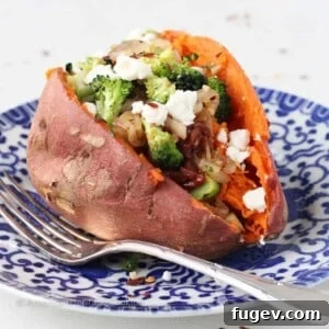 Stress-Free Thanksgiving Recipes 25 Vegetarian Stuffed Sweet Potatoes, colorful and appealing, served on a blue plate.