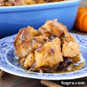Stress-Free Thanksgiving Recipes 48 A close-up of pumpkin bread pudding, adorned with cherries and pecans, highlighting its rich texture.