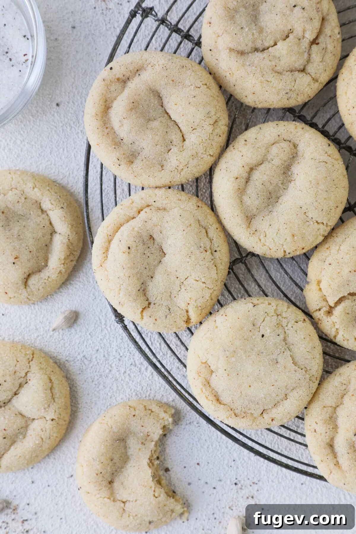 24 Irresistible Christmas Cookies 14 Browned Butter Cardamom Snickerdoodles cooling on a wire rack.