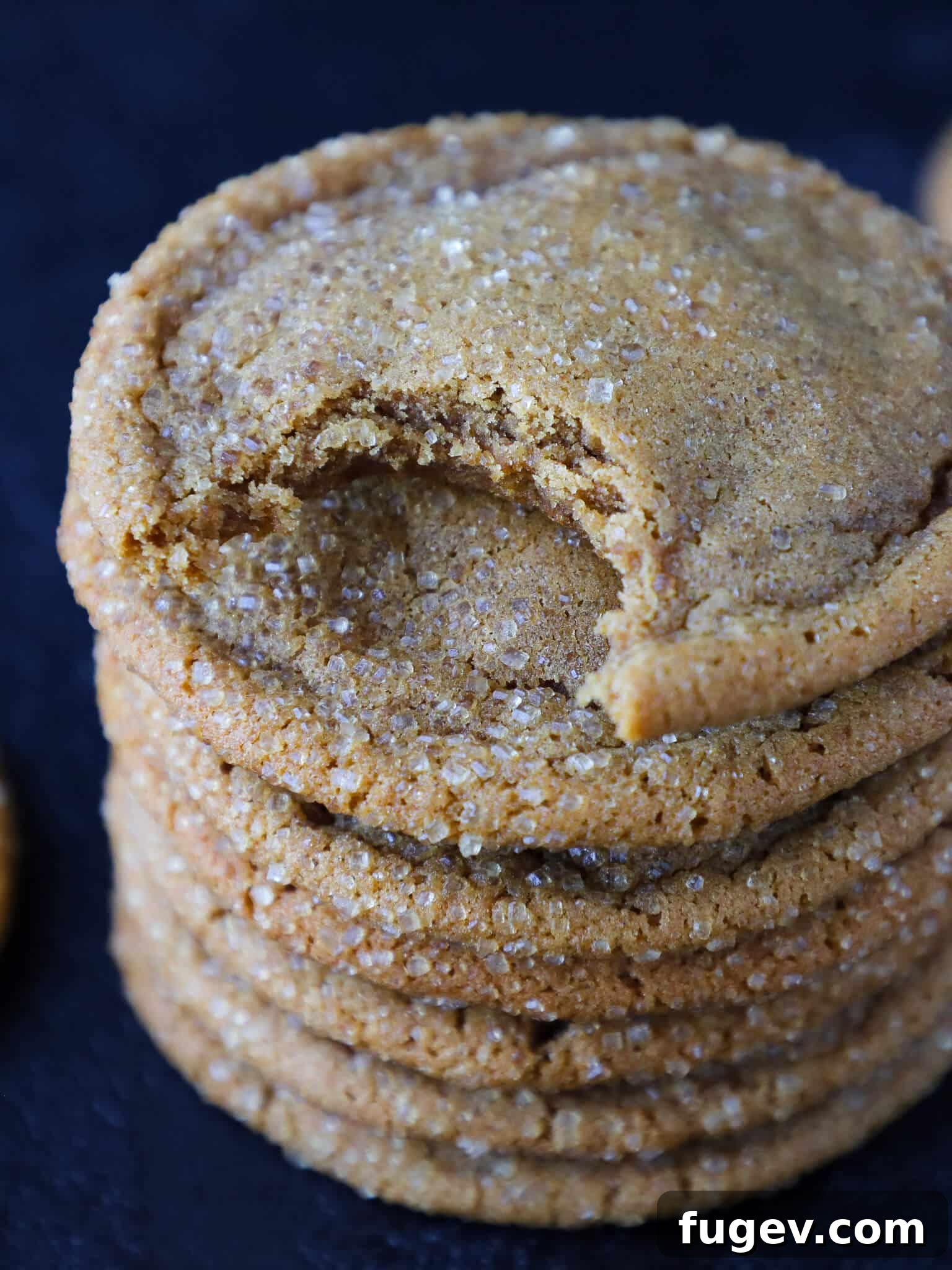24 Irresistible Christmas Cookies 3 Stack of Chewy Molasses Cookies, a traditional Christmas favorite, glistening with sugar.