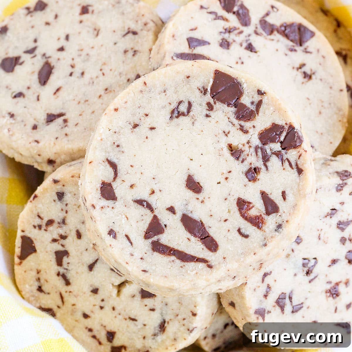 24 Irresistible Christmas Cookies 24 Chocolate Chip Shortbread Cookies nestled in a yellow towel.