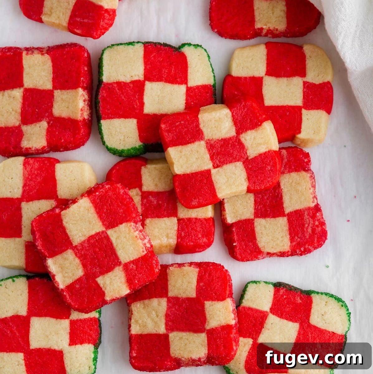24 Irresistible Christmas Cookies 26 White and red peppermint checkerboard cookies, showcasing their intricate pattern.