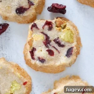 Pistachio Cranberry Sablee Cookie, whole, showcasing its vibrant inclusions.
