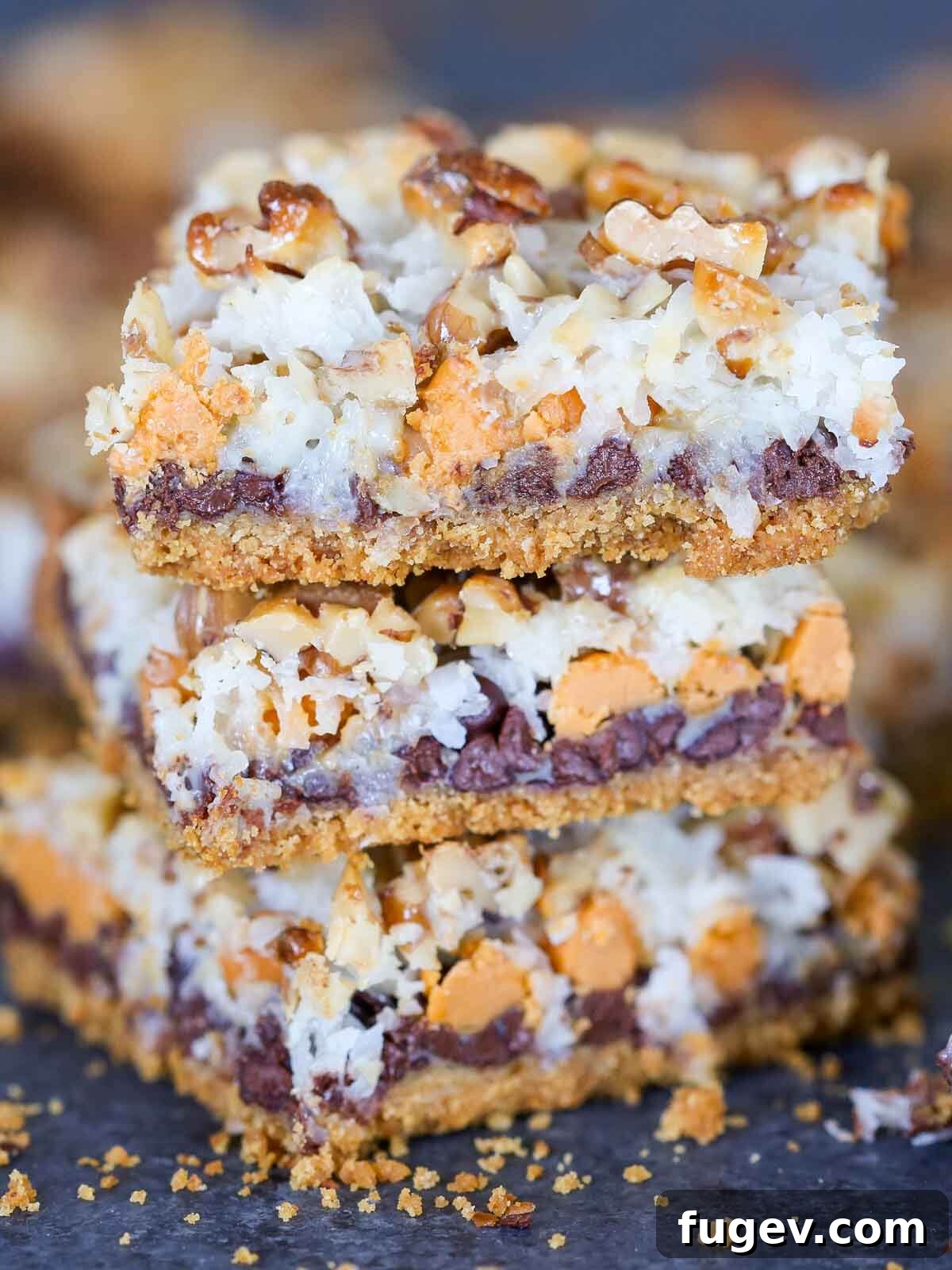 24 Irresistible Christmas Cookies 52 Stacked 7 layer bars, close up, revealing all their delicious layers.
