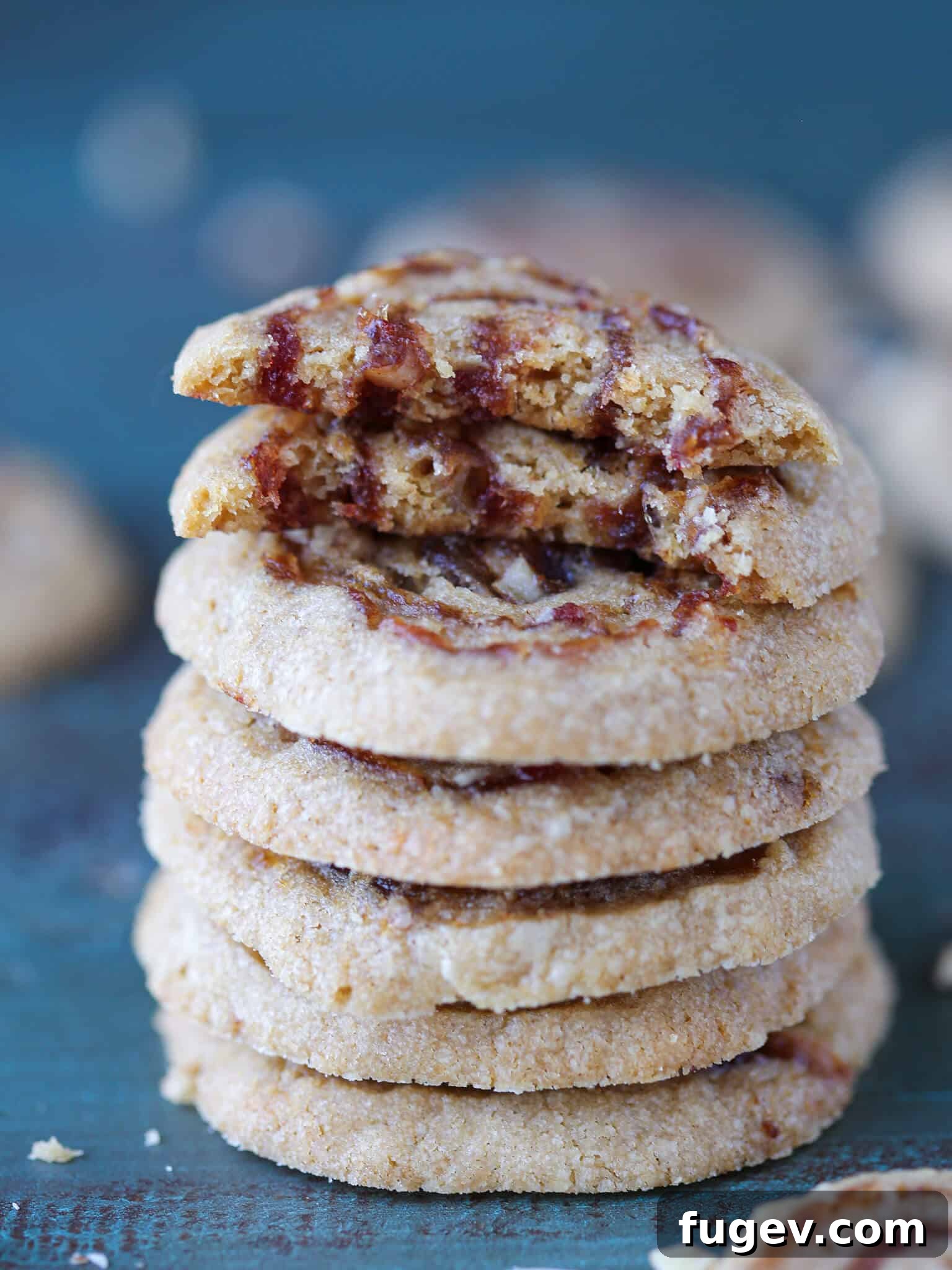 24 Irresistible Christmas Cookies 10 Old Fashioned Date Pinwheels stacked with one broken open, showing the sweet date filling.