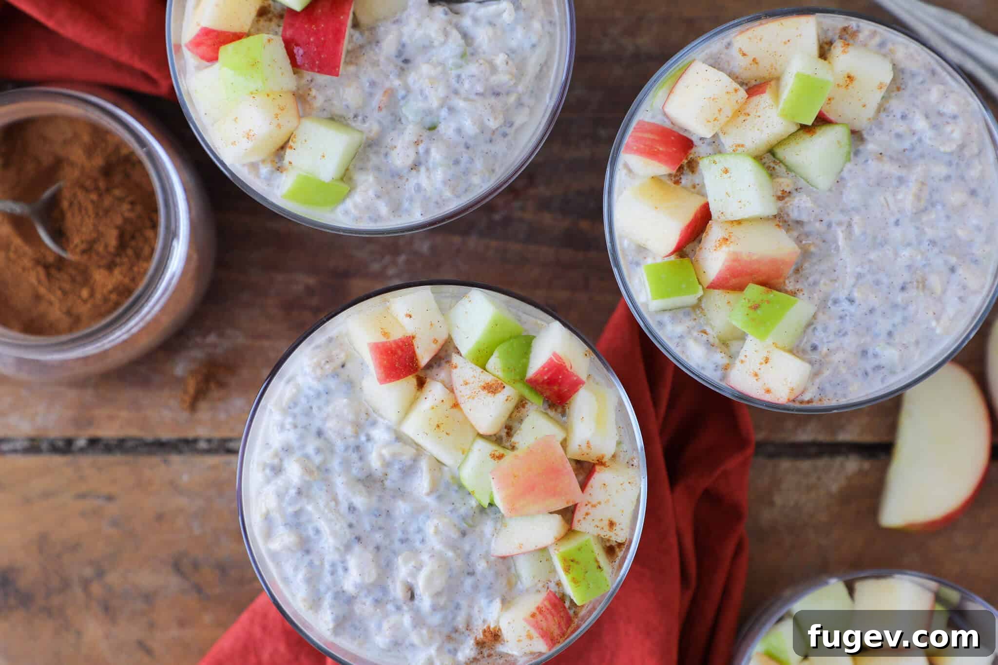 Cozy Apple Pie Overnight Oats 5 An inviting autumn breakfast tablescape featuring a bowl of Apple Pie Overnight Oats, surrounded by seasonal decor like pumpkins and leaves, creating a cozy and rustic ambiance.