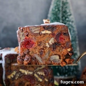 Delicious serving of fruit cake, showcasing its rich, festive appearance.