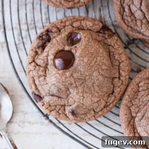 Nutella Chocolate Chip Cookies cooling on a circular cooling rack.
