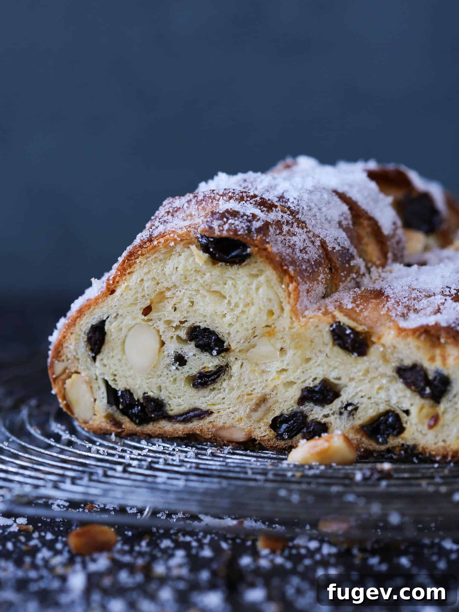 Bake the Perfect Holiday Stollen 2 Stollen Studded Fruit - A beautifully baked Stollen bread, generously studded with various dried fruits and nuts, ready for the holidays.