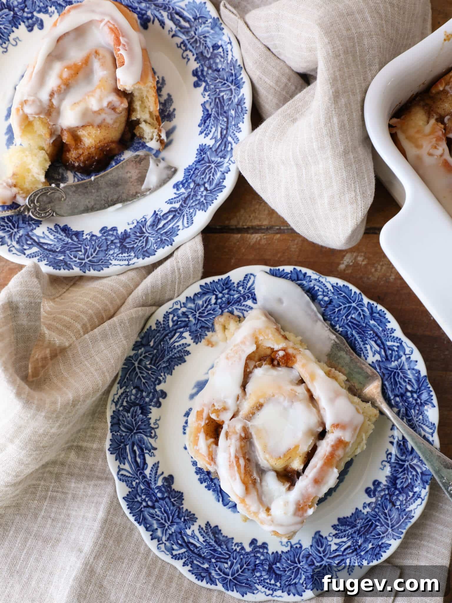 Warm Apple Cinnamon Rolls 3 Two plates of Apple Cinnamon Rolls with Cream Cheese Frosting