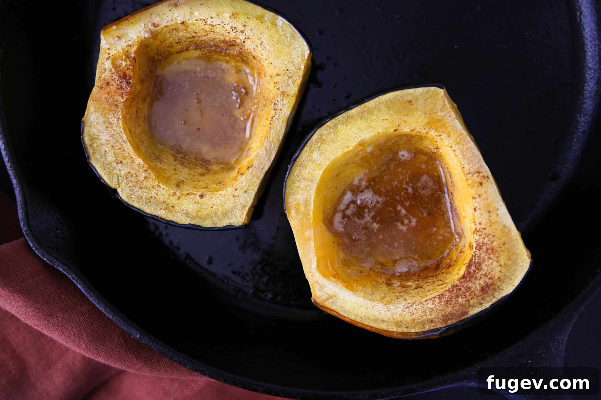 Golden Baked Acorn Squash 5 Two halves of Brown Sugar Baked Acorn Squash roasted to perfection