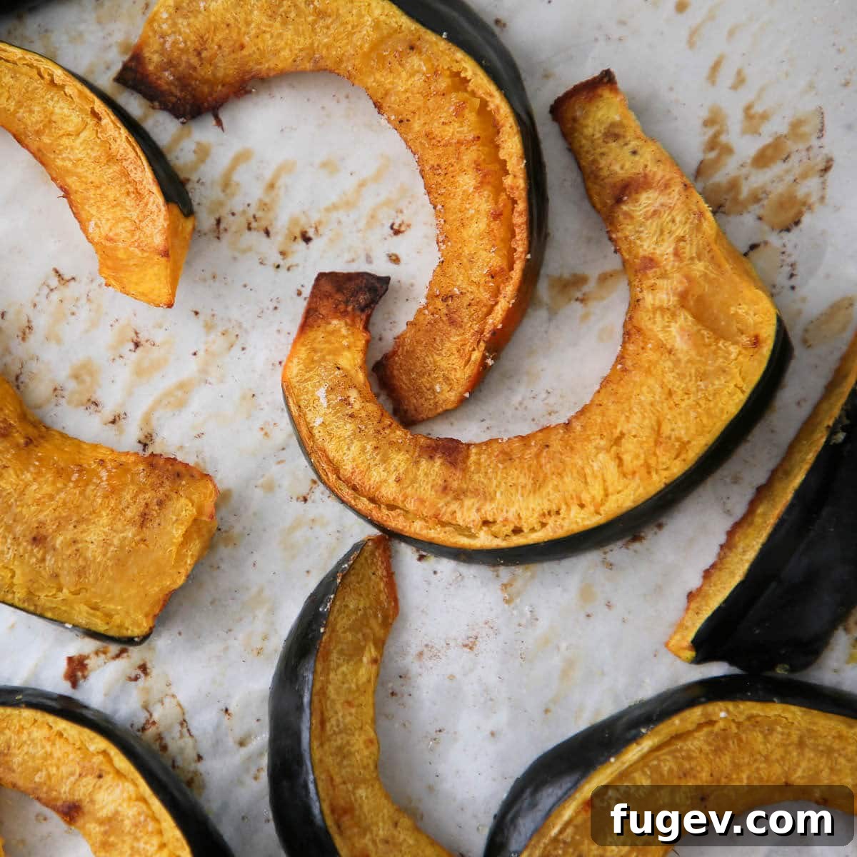 Caramelized Acorn Squash Slices 3 Healthy Roasted Acorn Squash with a white background, highlighting its natural beauty.