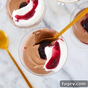 Chocolate Mousse in glass with gold spoon, an elegant and easy dessert option.