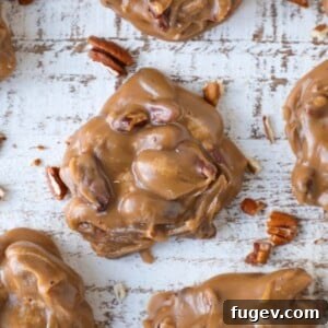 A decadent brown pecan praline on a brown slate board amid a group, a delightful Southern treat.