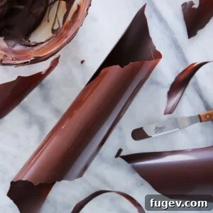 How to temper dark chocolate, tempered chocolate on marble, demonstrating the process.
